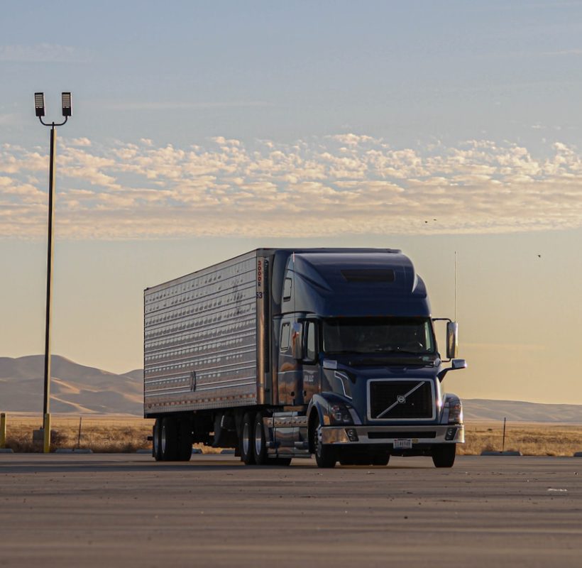 black truck on road during daytime